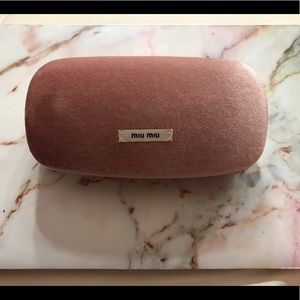 Miu Miu sunglass case.